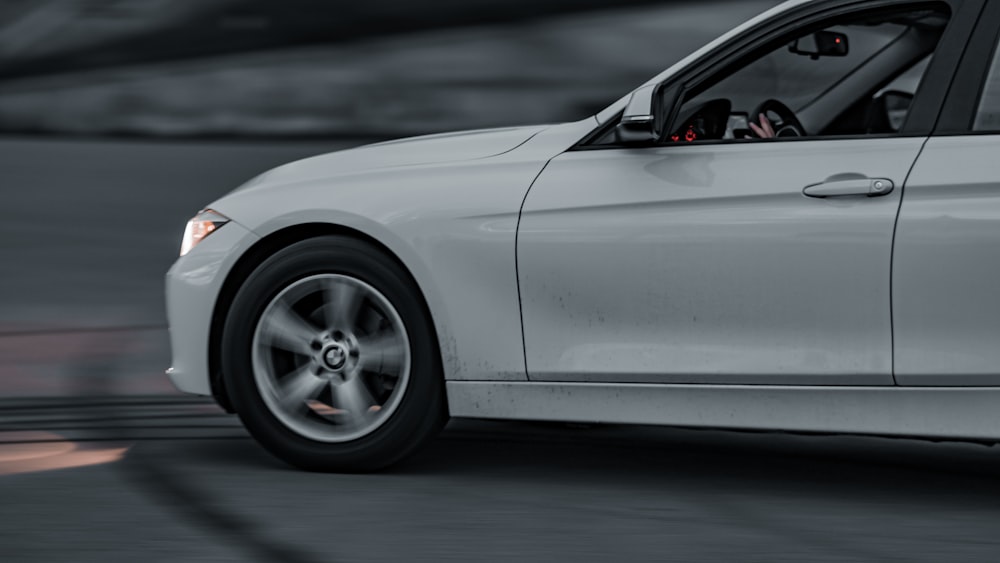 white car on gray asphalt road