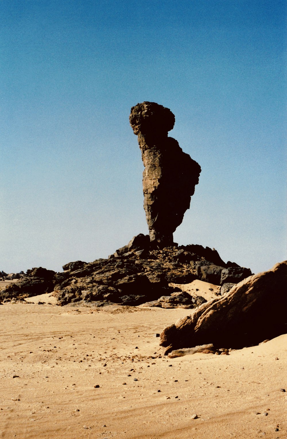 brown rock formation under blue sky during daytime