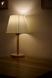 A stylish table lamp casting soft light on a cozy reading nook