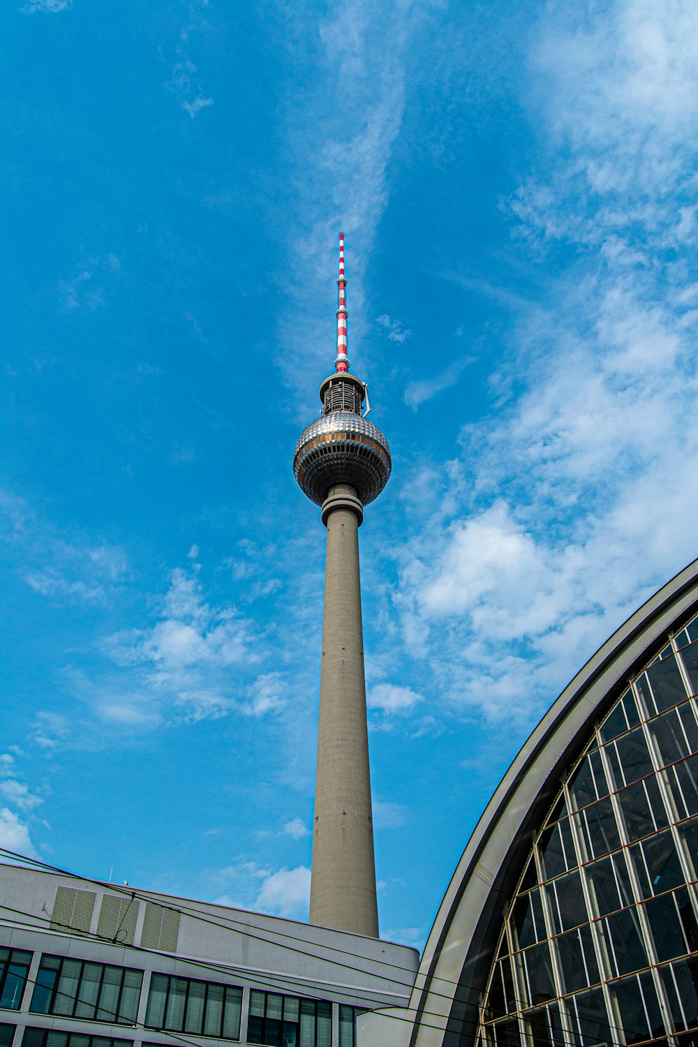 white and red tower under blue sky