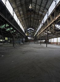 gray concrete building with white metal frame