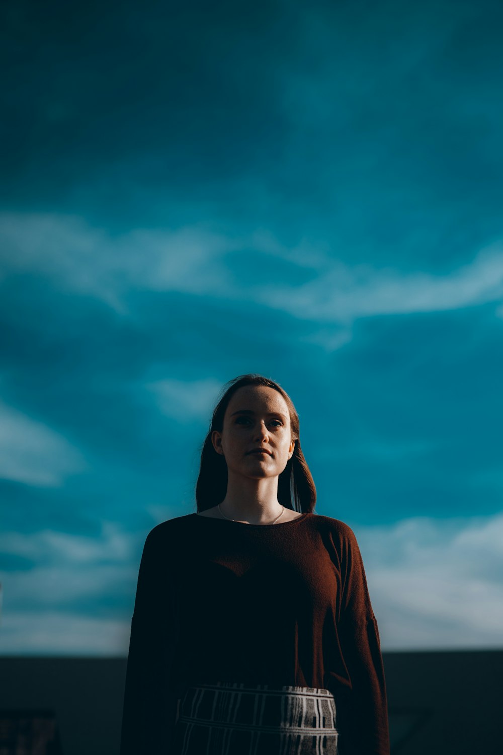 woman in black long sleeve shirt under blue sky during daytime