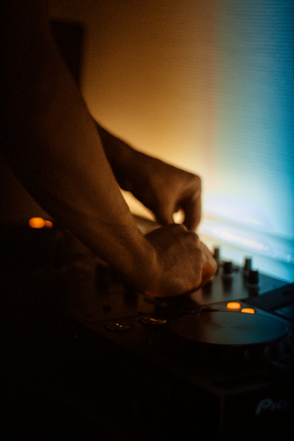 person holding black round plate