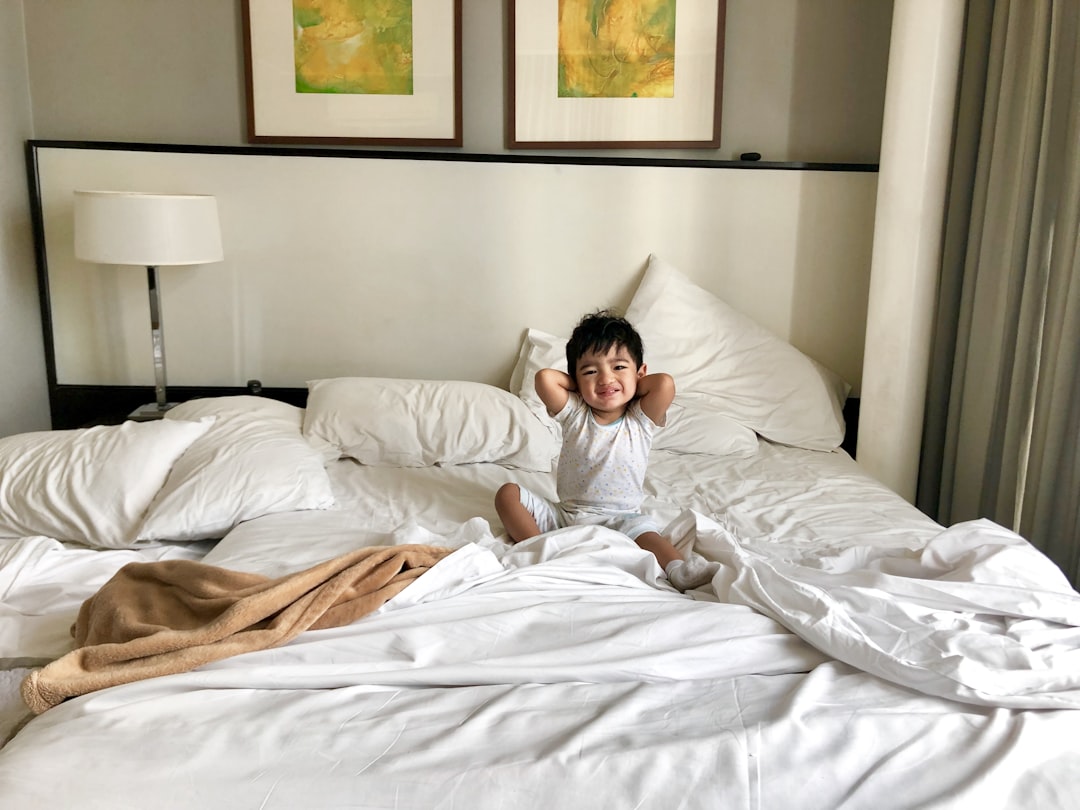 woman in white long sleeve shirt lying on bed, Good Morning!