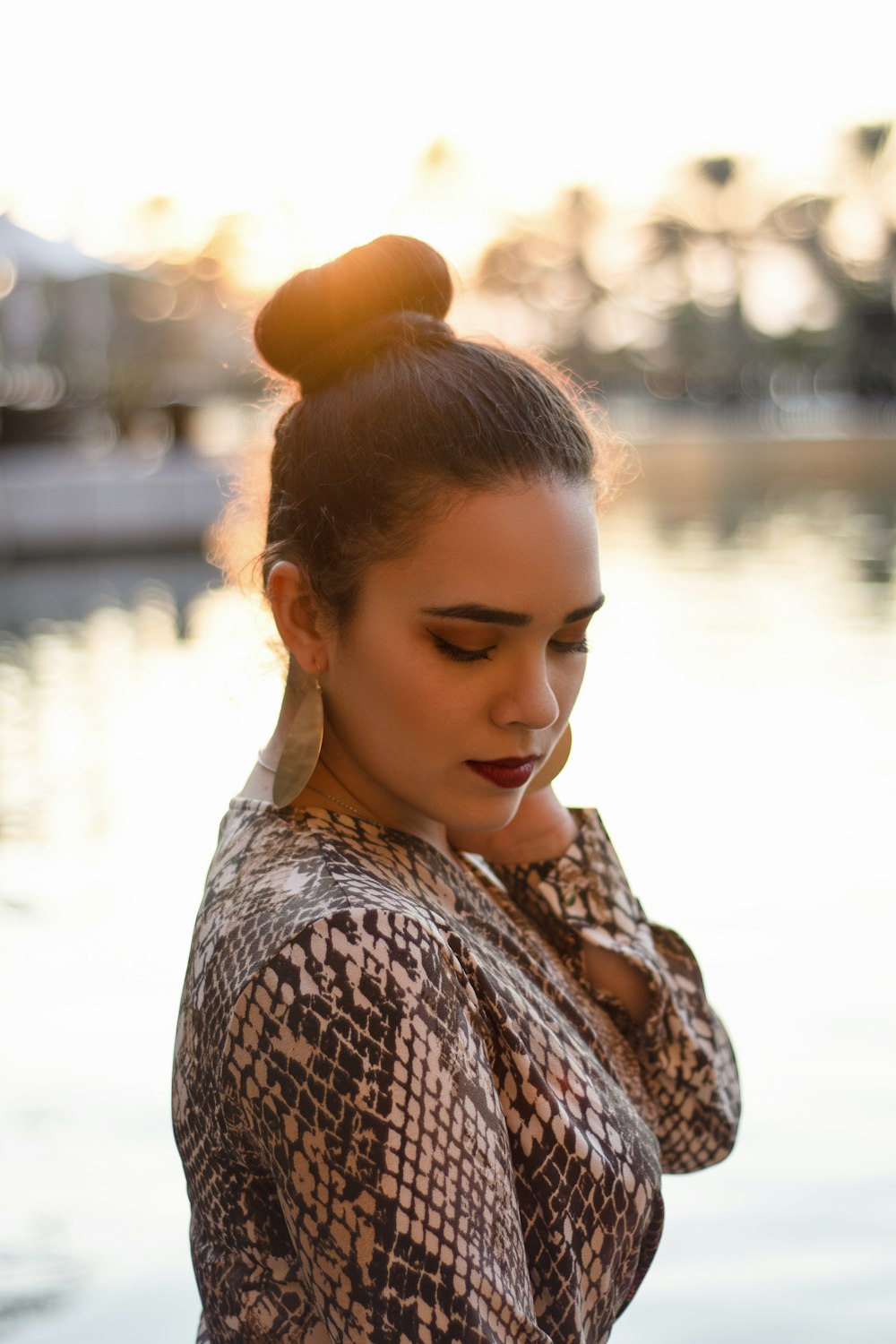 woman in brown and white shirt