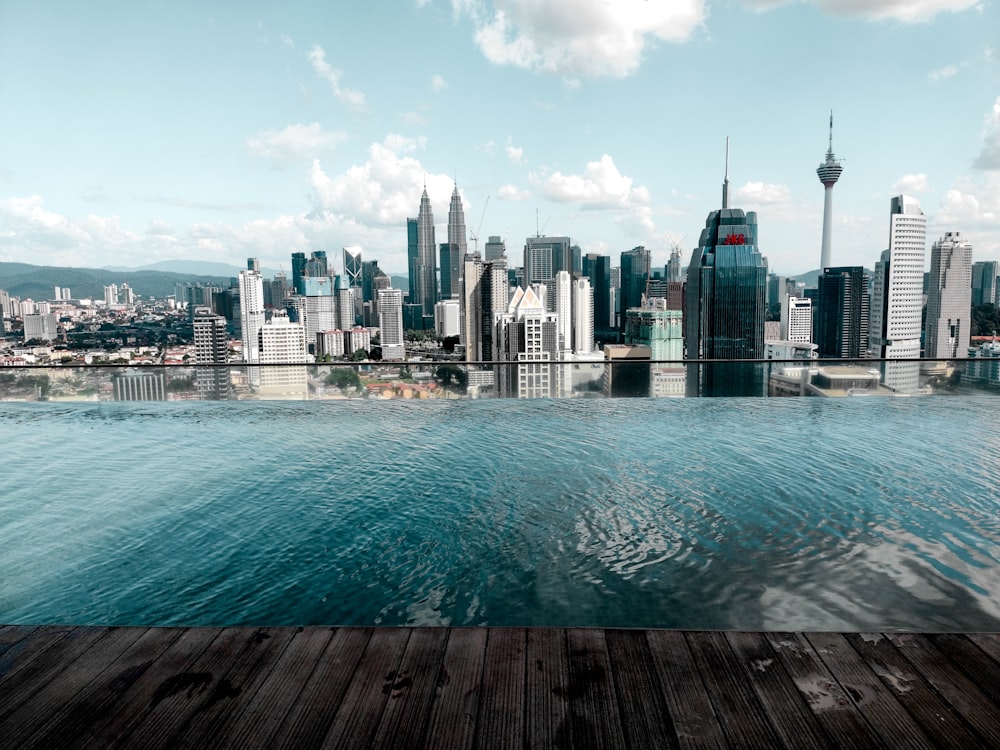 body of water near city buildings during daytime