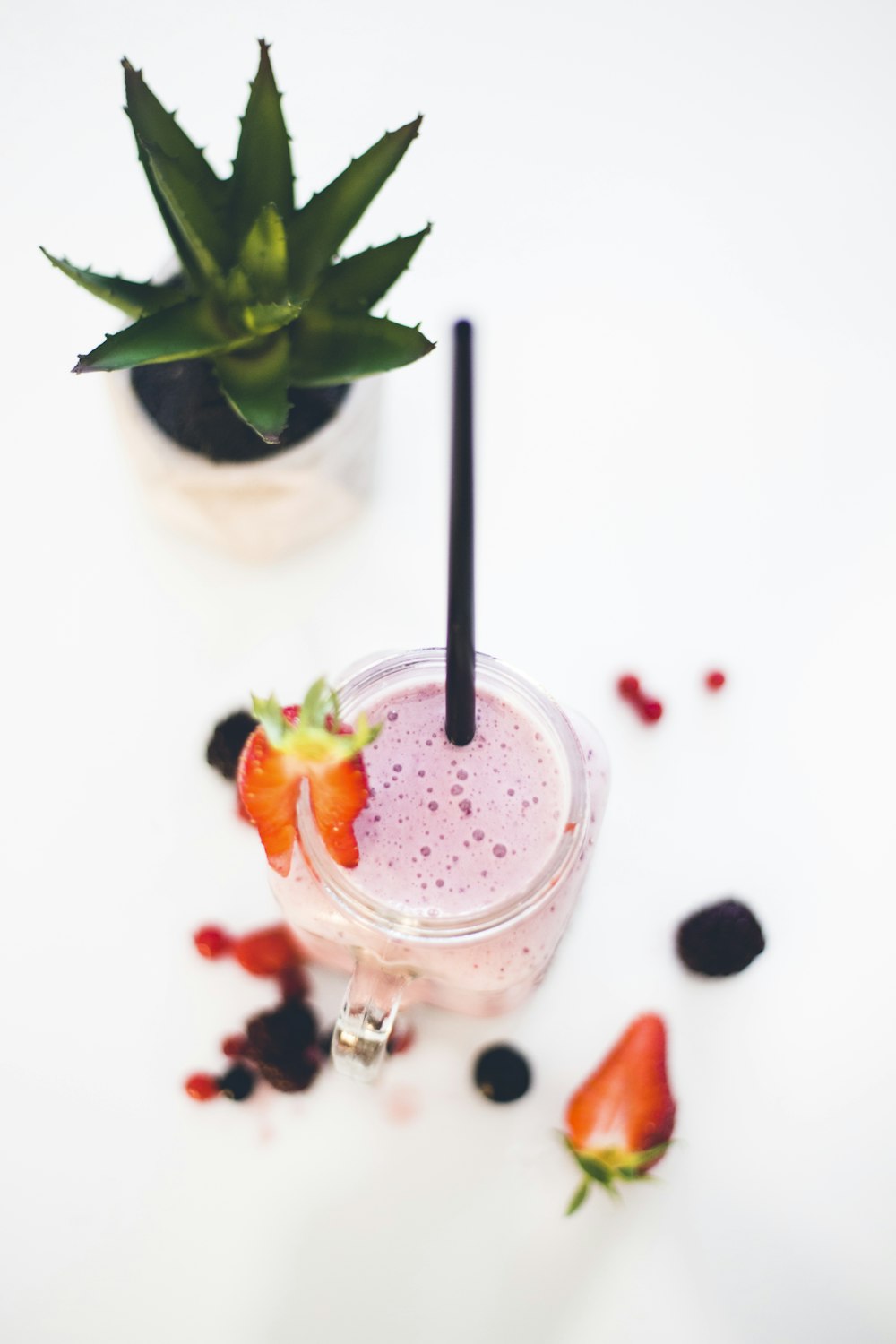 strawberry shake in clear drinking glass