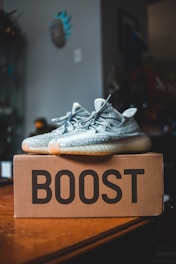 white and black adidas athletic shoe