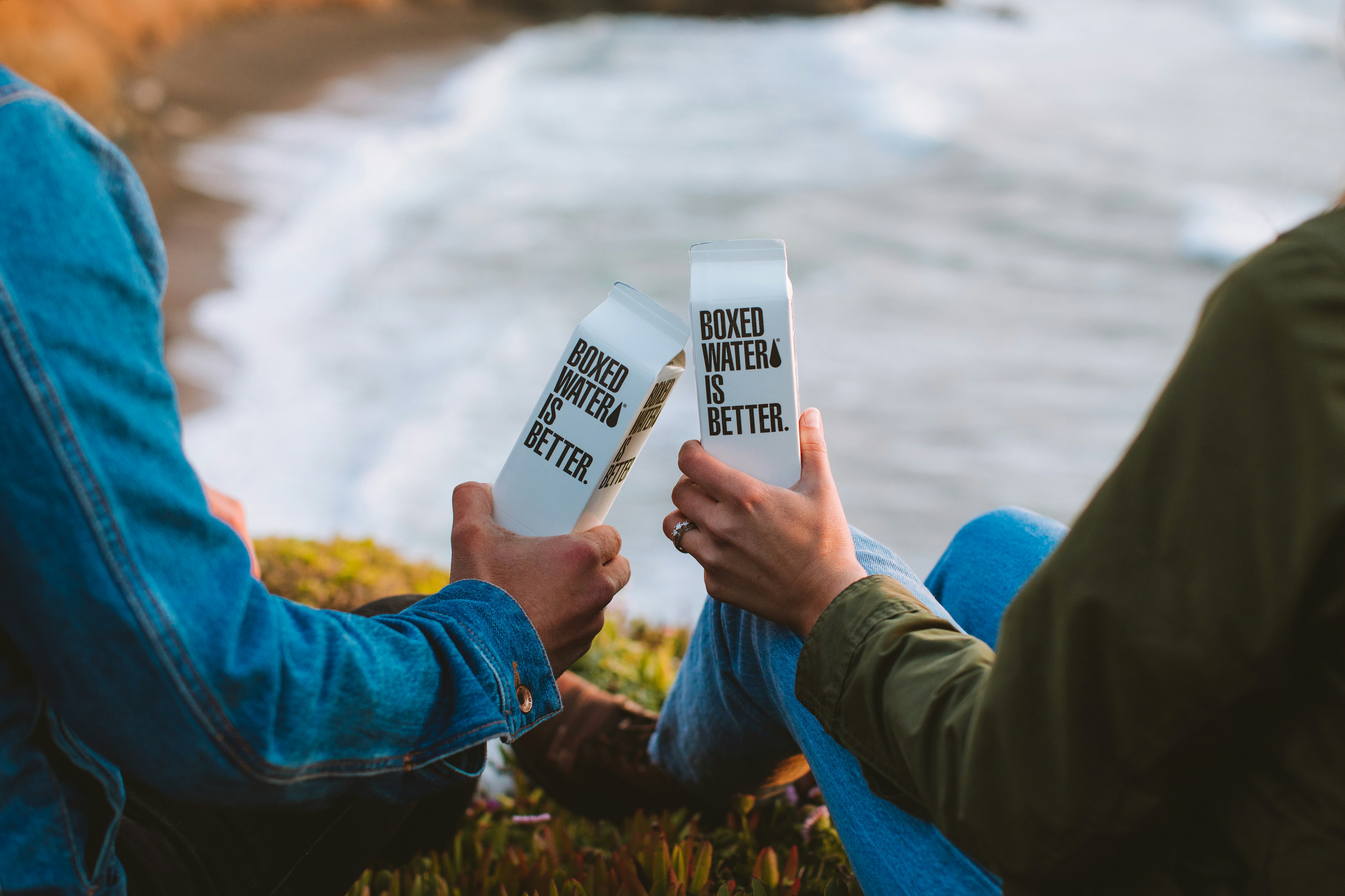person holding white plastic bottle
