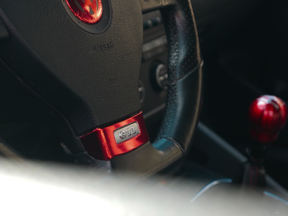 black and red honda steering wheel