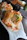 Close-up of an elegant sushi platter with colorful rolls and fresh garnishes on a sleek table.