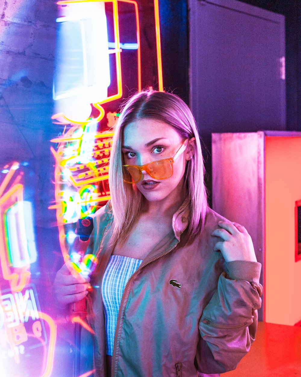 woman in gray coat wearing sunglasses