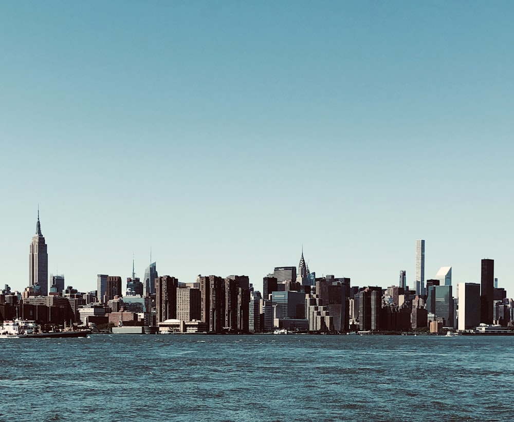 city skyline under blue sky during daytime