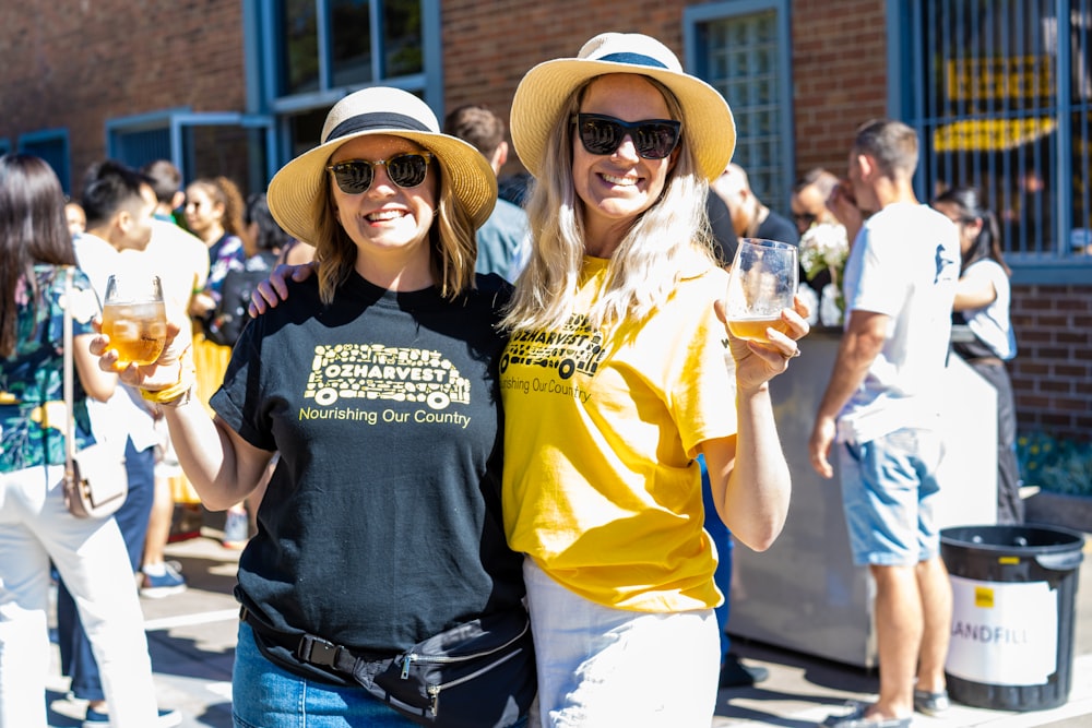 man in yellow crew neck t-shirt beside woman in black crew neck t-shirt