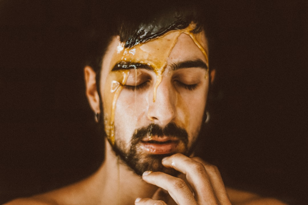 man with black and white face paint