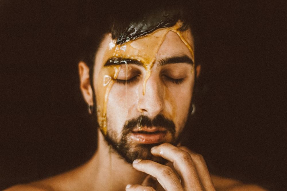 man with black and white face paint