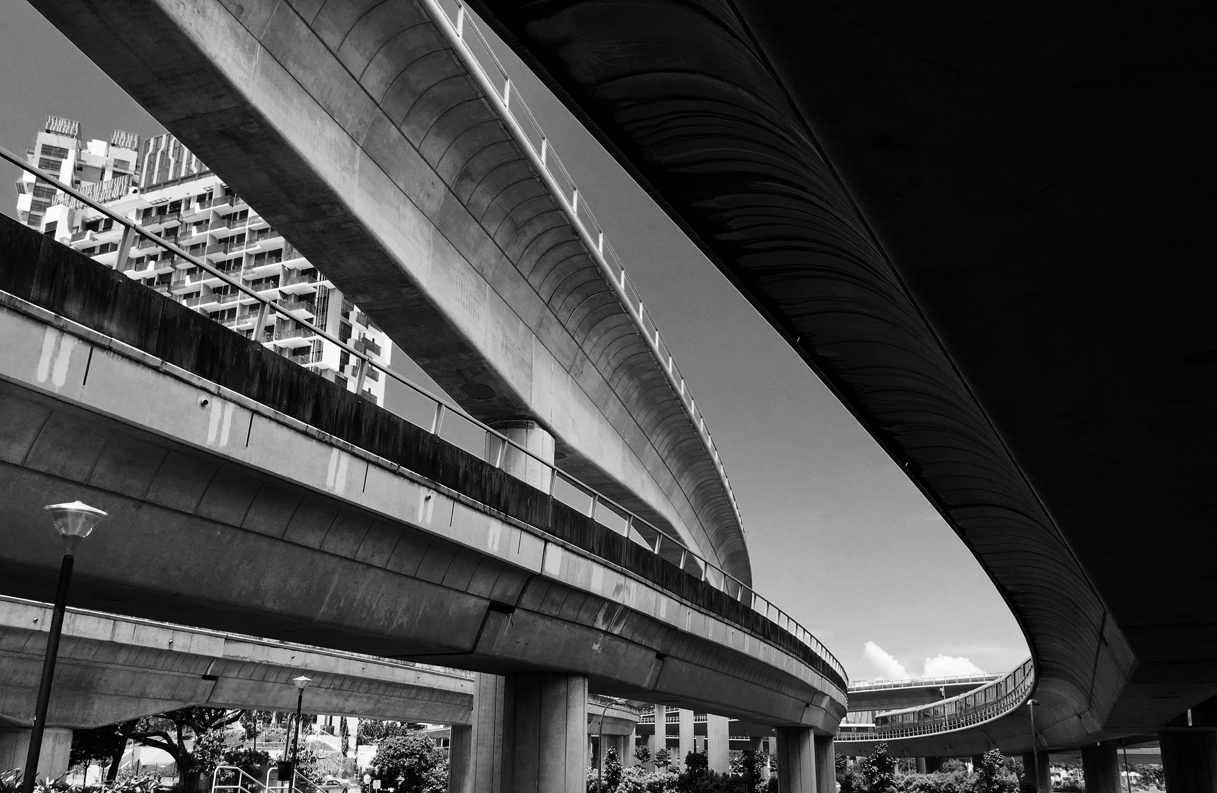 grayscale photo of people walking on sidewalk