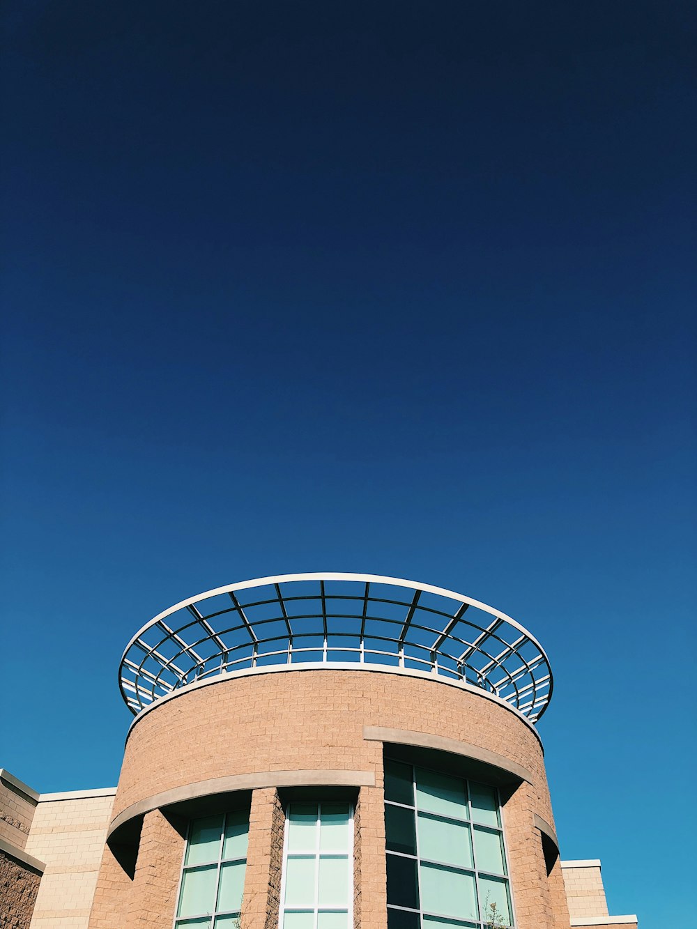 brown and white concrete building under blue sky during daytime