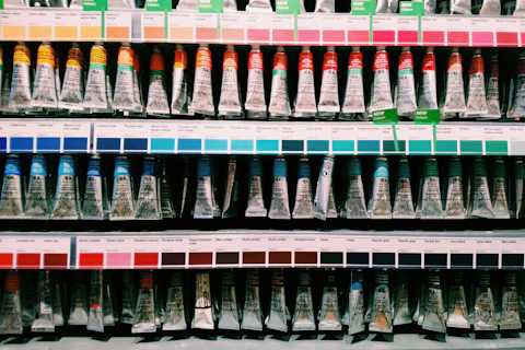 blue and white plastic bottle on white shelf