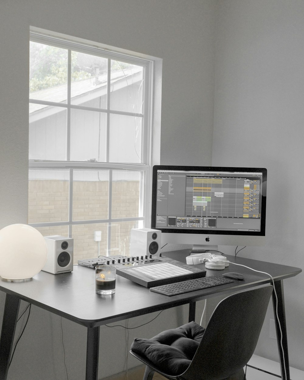 black flat screen computer monitor on white wooden desk