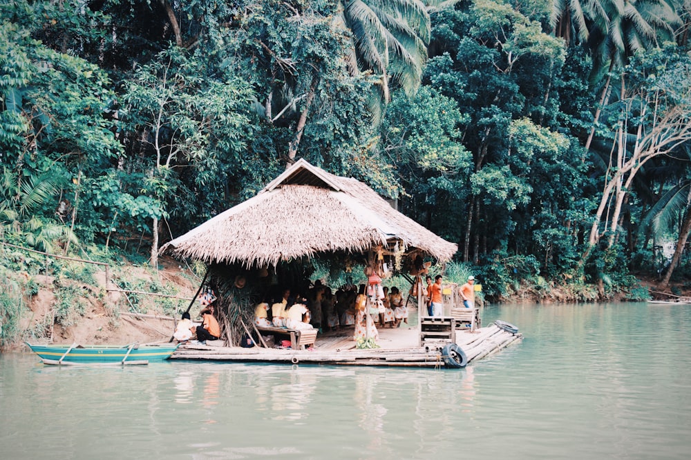 people riding boat on river during daytime