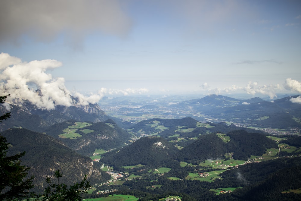 green mountains under white clouds during daytime