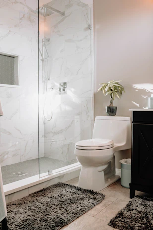 white ceramic toilet bowl beside white ceramic toilet bowl