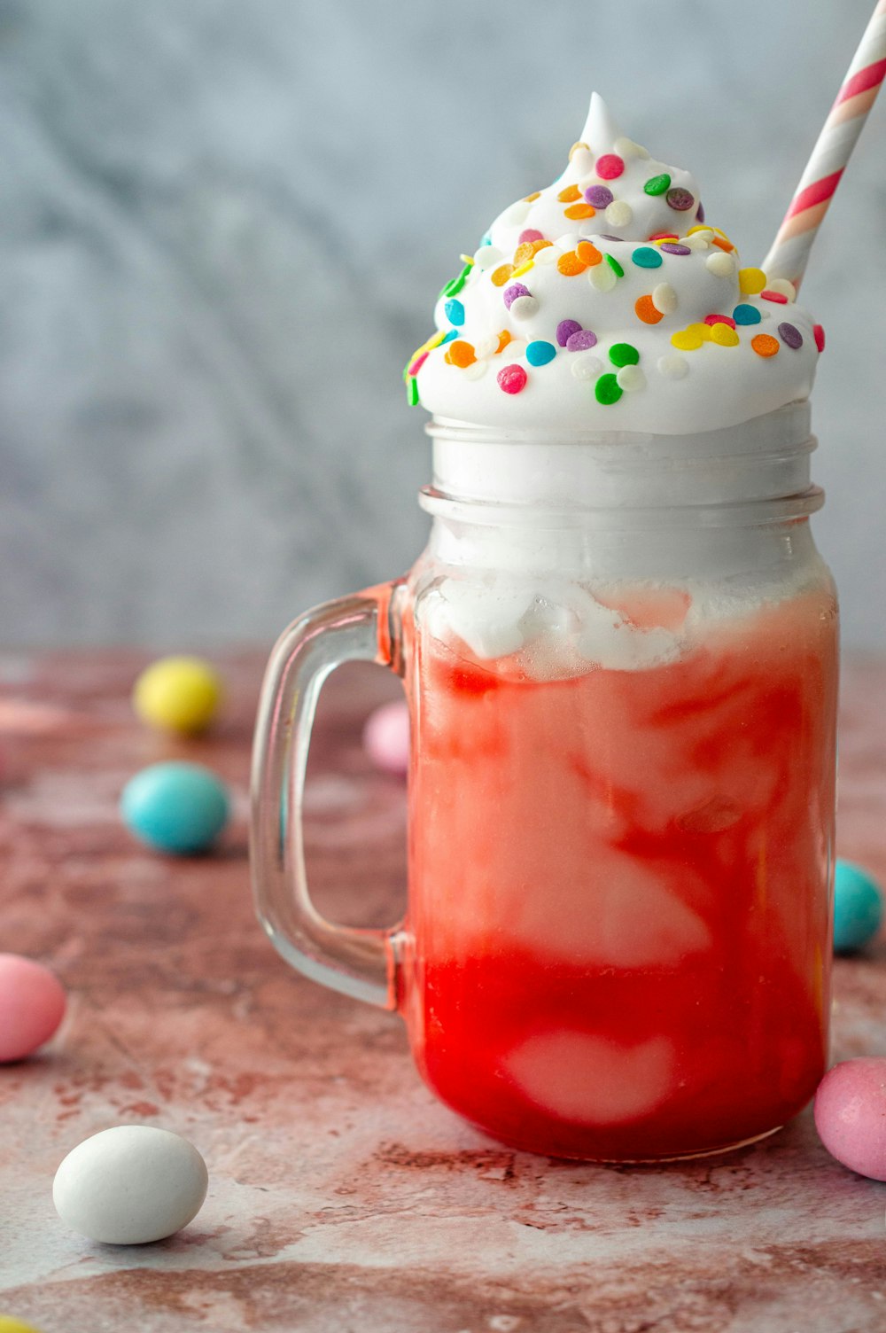 clear glass mug with red liquid