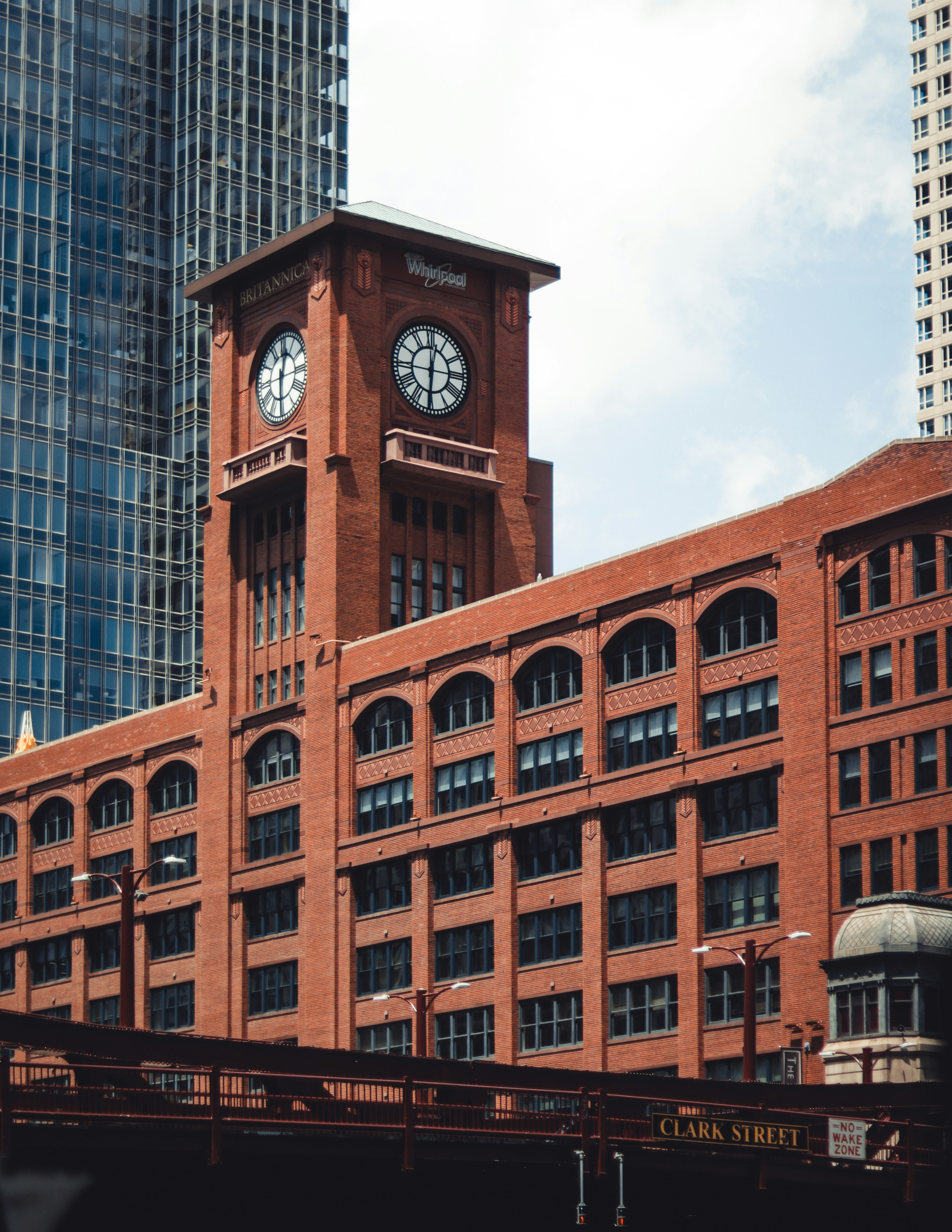 brown and black concrete building under white clouds during daytime