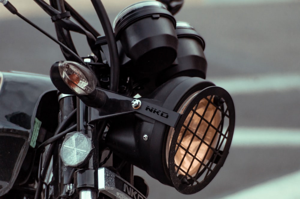 black motorcycle with orange light