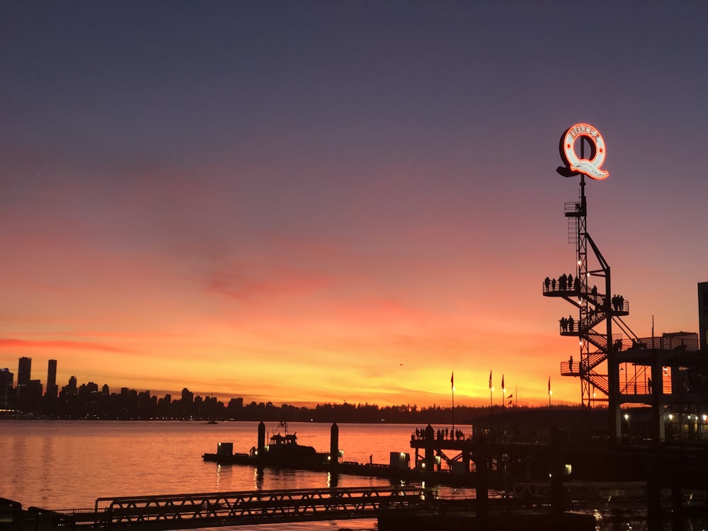 silhouette of ship on sea during sunset