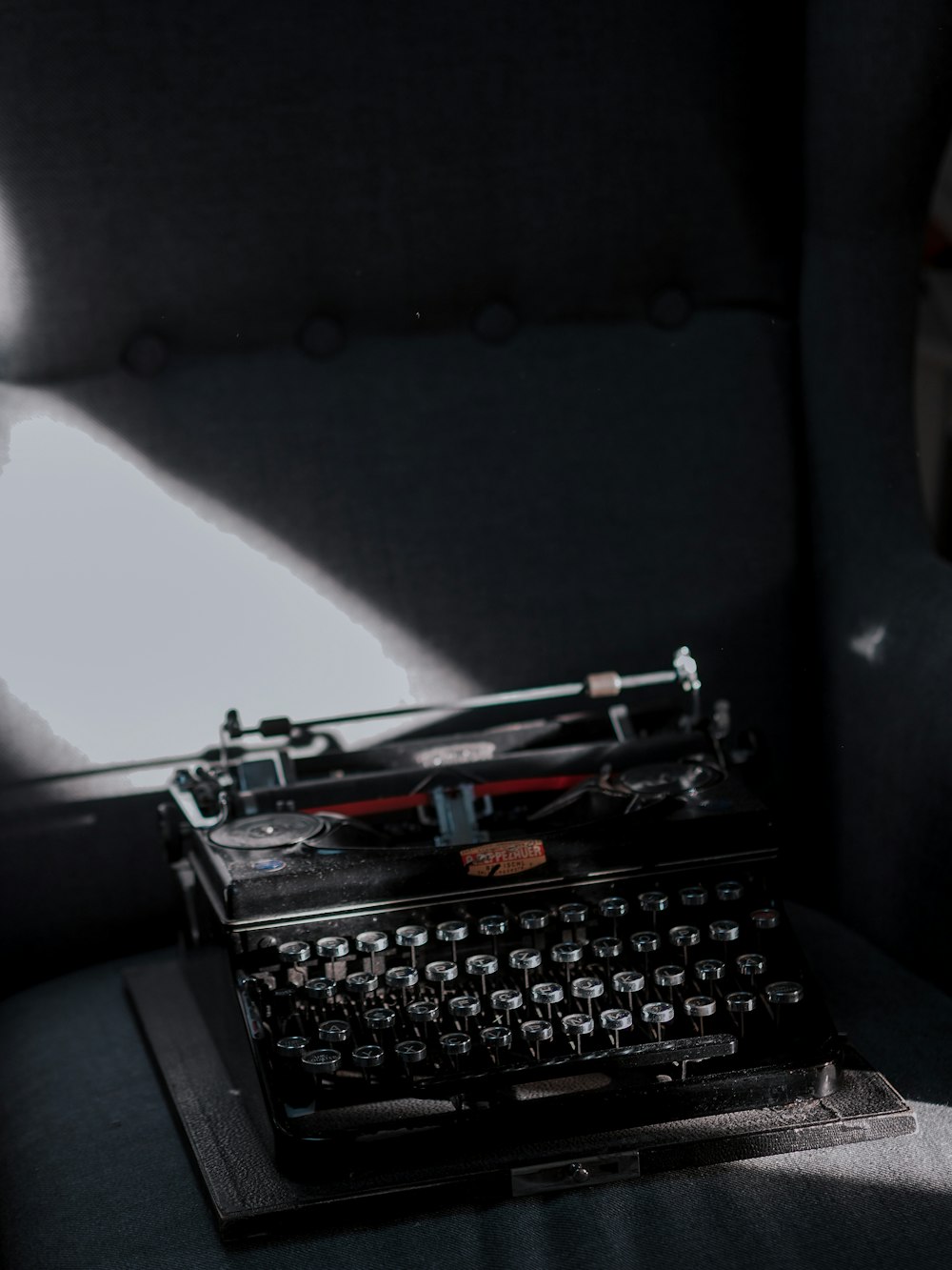 black typewriter on black car seat