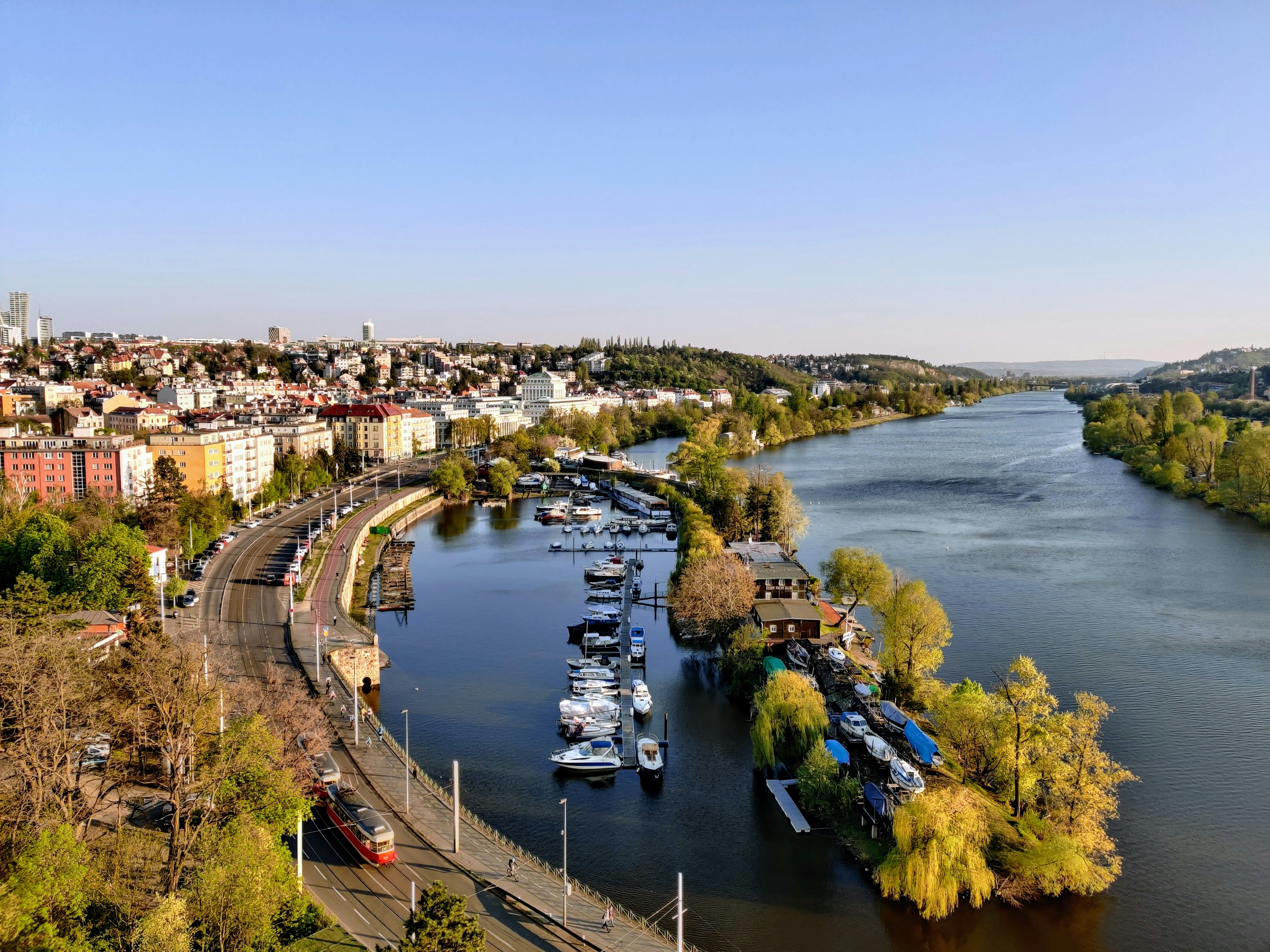 aerial view of city buildings near body of water during daytime