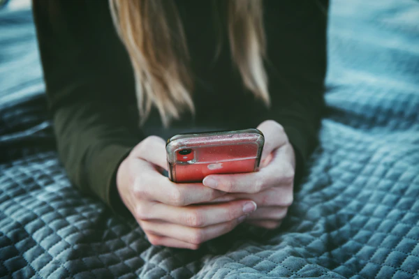 A person using a dating app on their smartphone