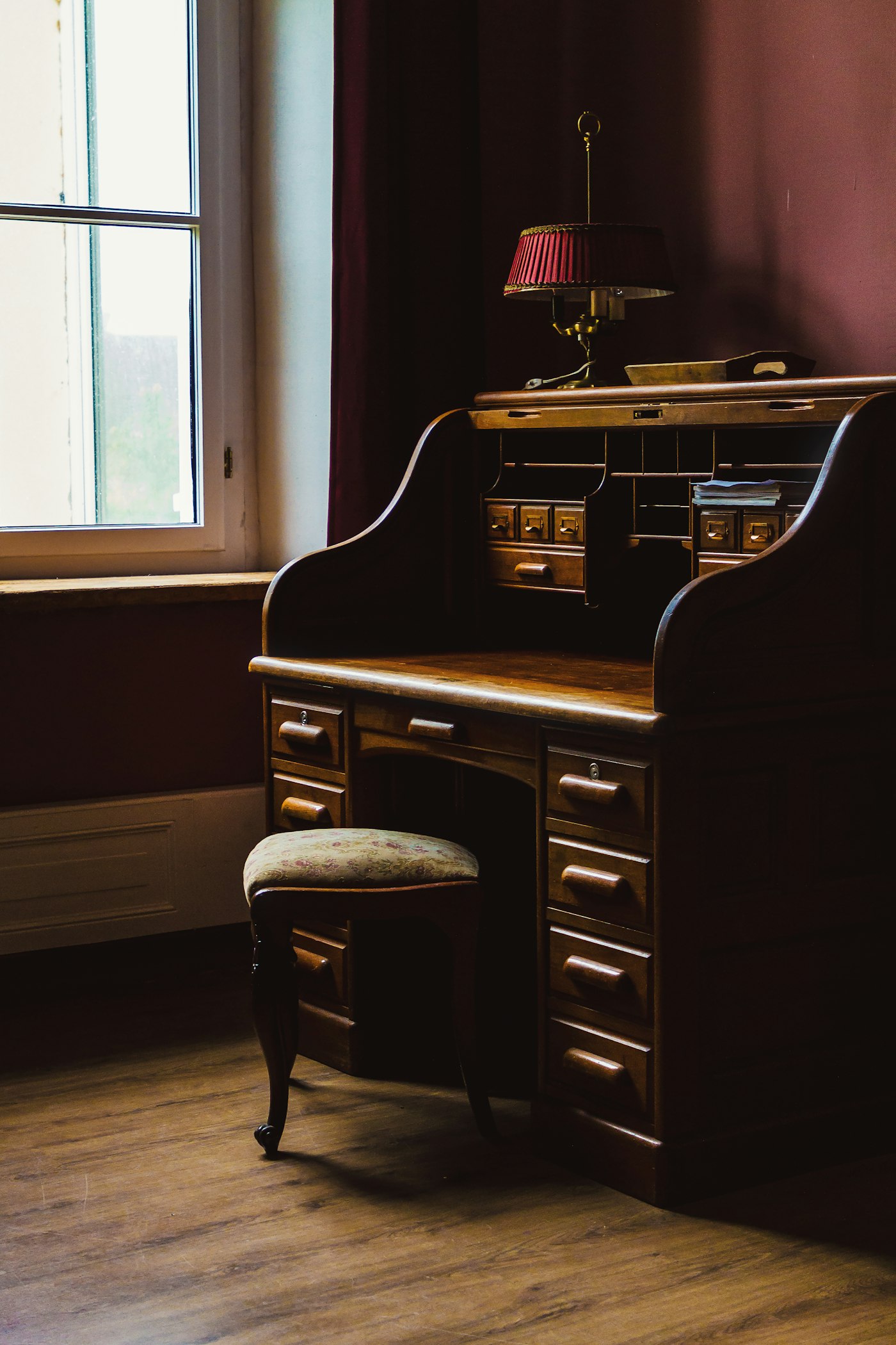 Wooden roll-top writing desk in a quiet office