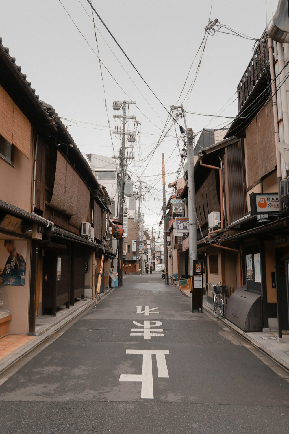 empty street between buildings during daytime