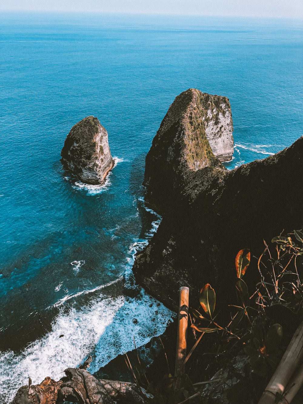 gray rock formation on blue sea during daytime