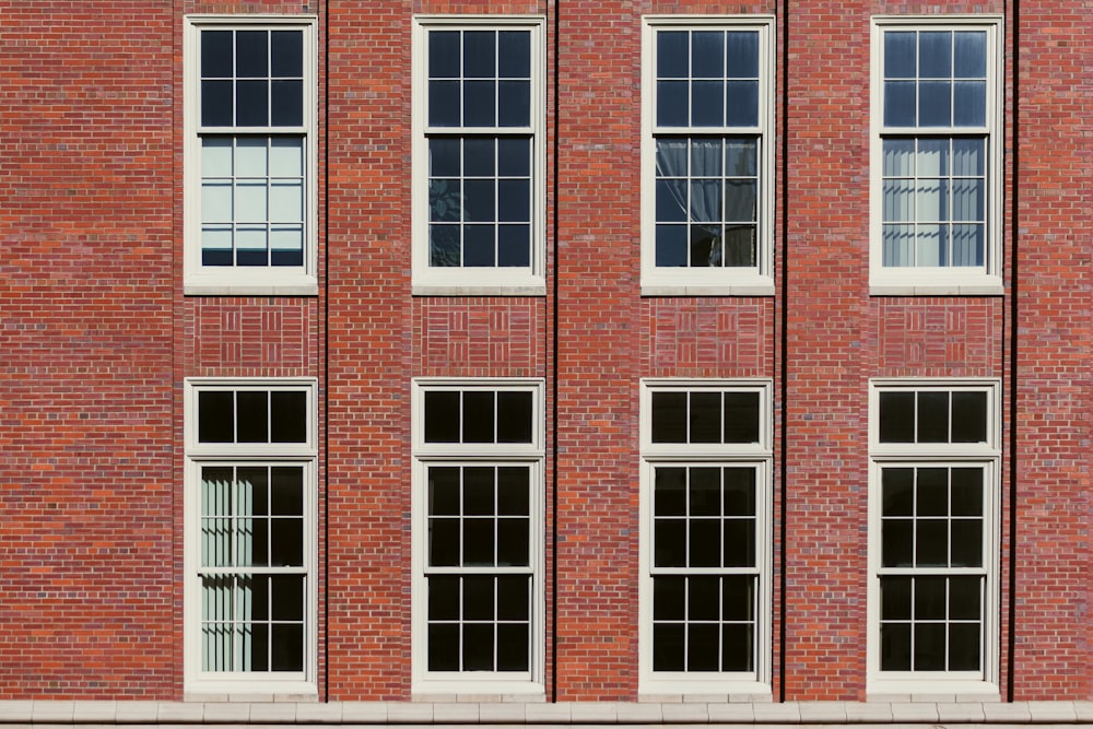 brown brick building with windows