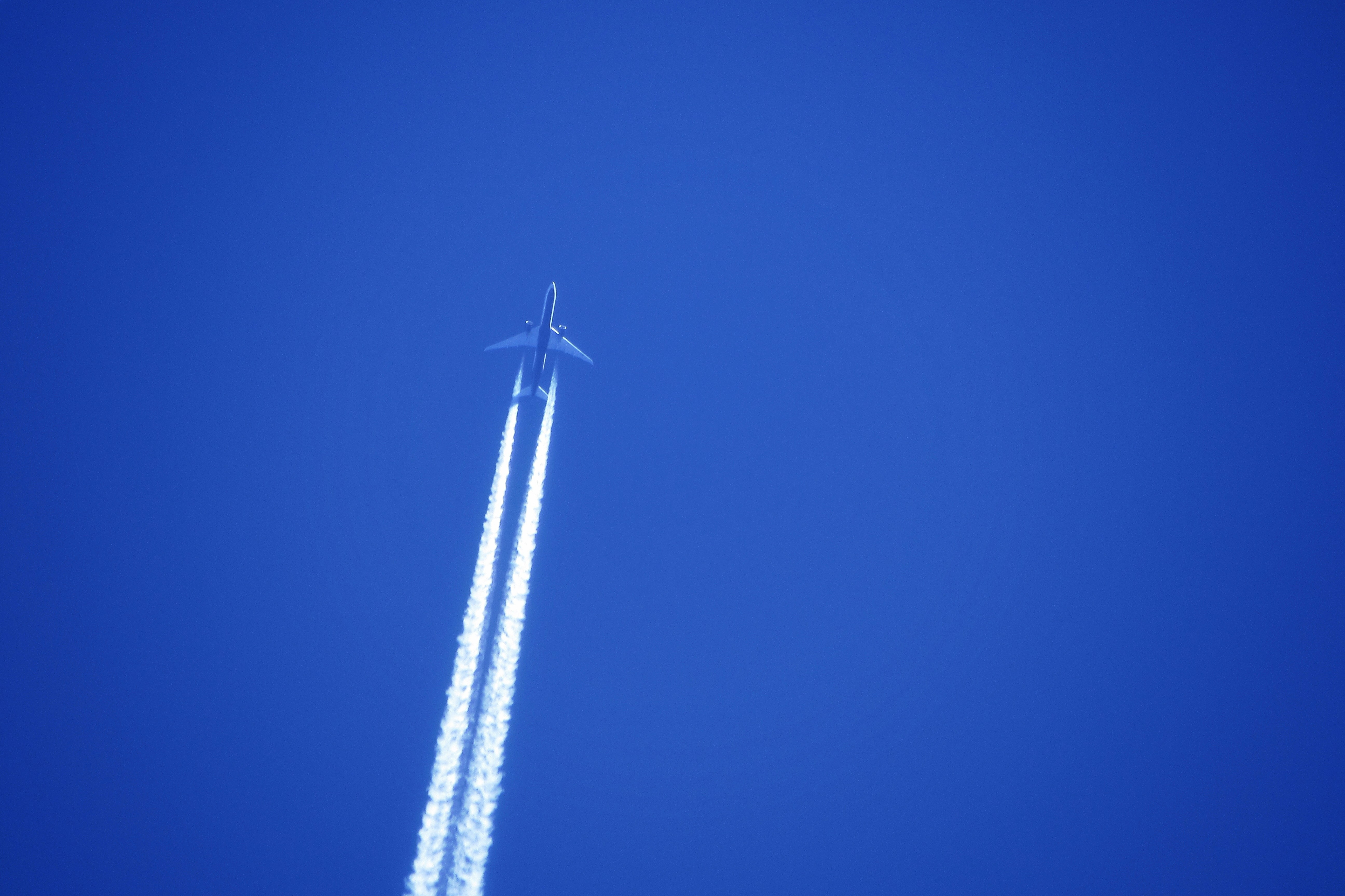white plane in the sky, Boeing 777 flying over Lerwick, Shetland Islands on the 20th of April 2020 ✈️