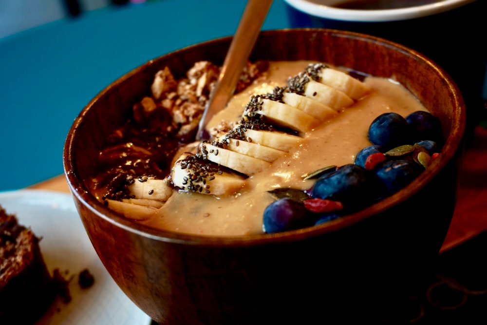 brown wooden chopsticks on blue ceramic bowl