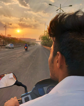 A rider enjoying a smooth ride on a freshly tuned motorcycle at sunset