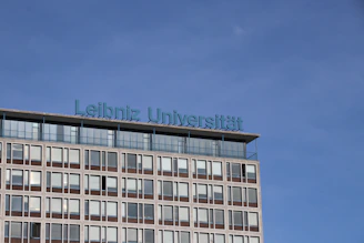 Photo of fs wiso kiel team members smiling together in front of the university building.
