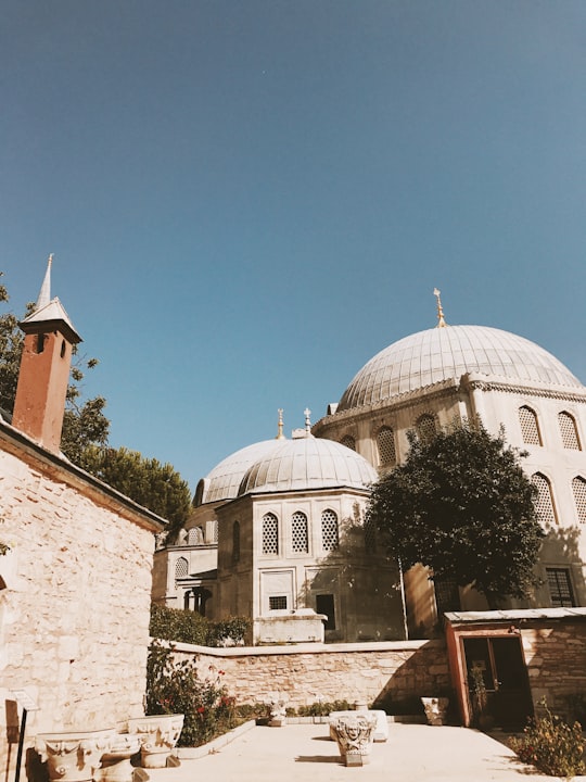 white and brown concrete building under blue sky during daytime in Hagia Sophia Museum Turkey