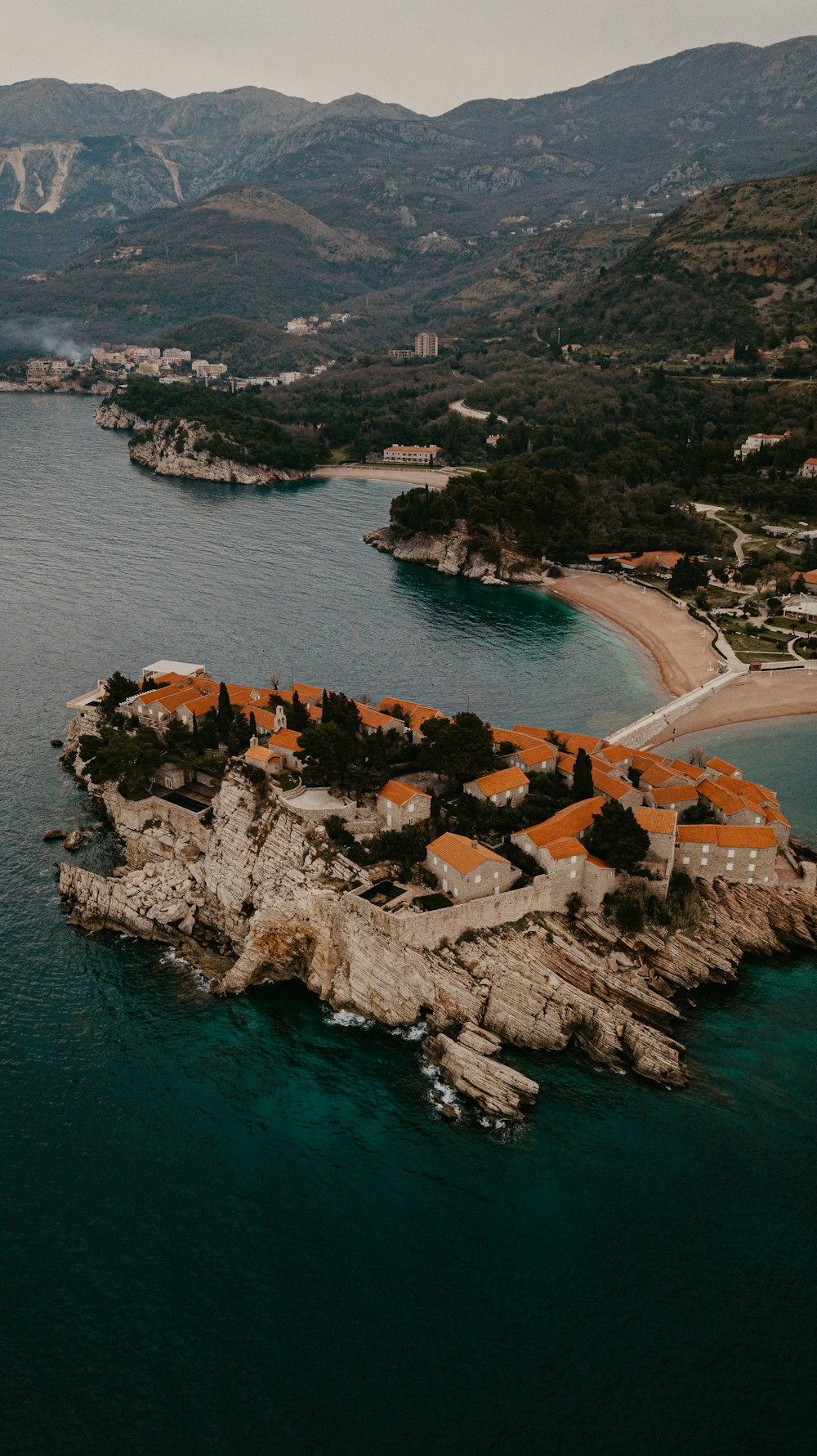 an aerial view of a small island in the middle of the ocean