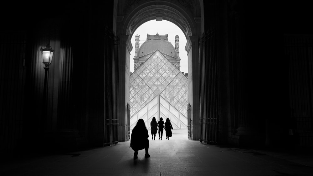 silhouette of people walking on hallway