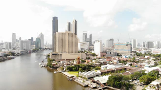 city buildings near body of water during daytime