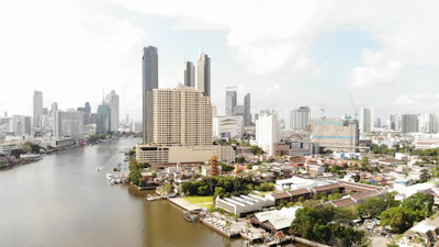 city buildings near body of water during daytime
