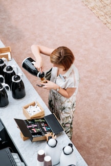 woman in white and brown floral dress sitting on chair