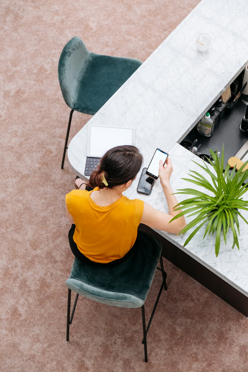 woman in yellow shirt sitting on chair