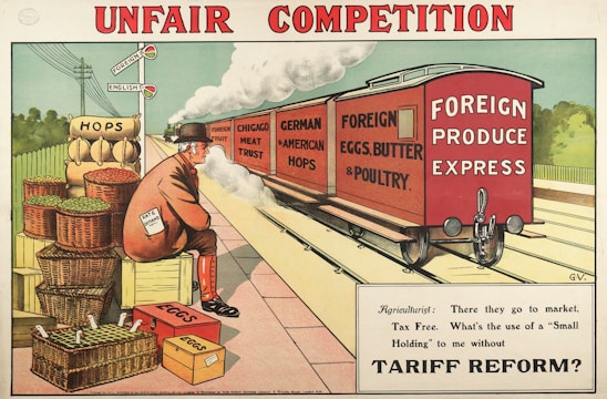 A railway scene depicting a freight train labeled 'Foreign Produce Express' carrying goods like 'Foreign Fruit', 'Chicago Meat Trust', 'German & American Hops', and 'Foreign Eggs, Butter & Poultry'. A man, wearing a suit and bowler hat with a paper that says 'Rate on Demand', sits on crates beside baskets labeled 'Hops' and 'Eggs'. A signpost with 'Foreign' and 'English' highlights economic themes. The caption below the image reads: 'Agriculturist: There they go to market, Tax Free. What’s the use of a “Small Holding” to me without Tariff Reform?'